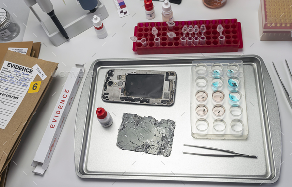 pieces of burnt smartphone involved in lab murder, concept image