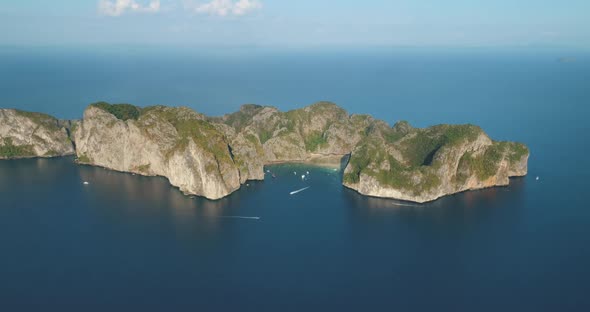 Aerial View Uninhabited Island with Trees in Middle Blue Sea alt