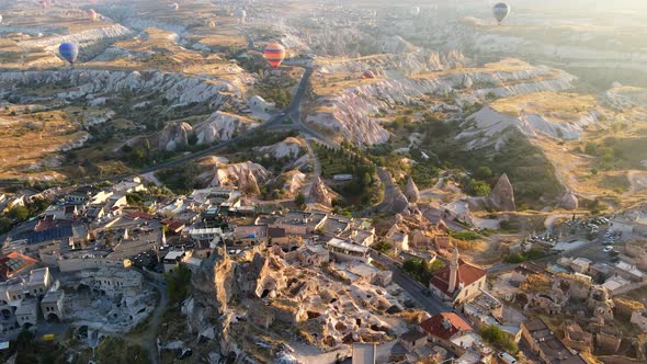Aerial view of Cappadocia. Colorful hot air balloons flying over the valleys