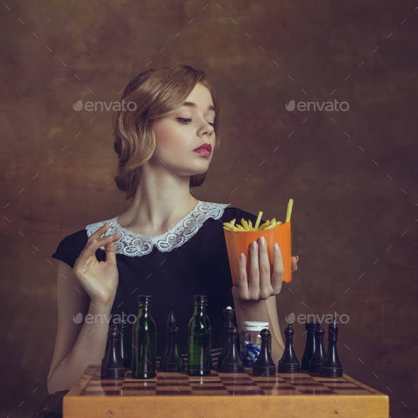 Young woman in art action isolated on brown background. Retro style, comparison of eras concept - Stock Photo - Images