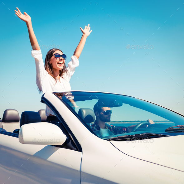 Couple in convertible.  - Stock Photo - Images