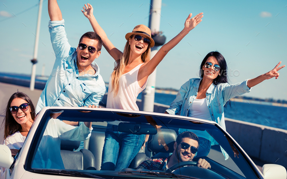 Friends in convertible.  - Stock Photo - Images