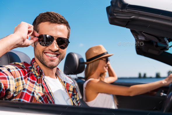 Couple in convertible.  - Stock Photo - Images