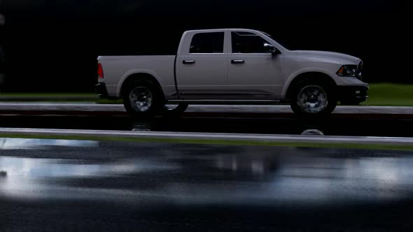 Pickup Truck On Long Rainy Wet Road