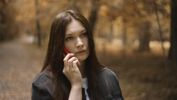 Woman with Long Hair Cute Talking on Mobile Phone with Parents in Autumn Forest