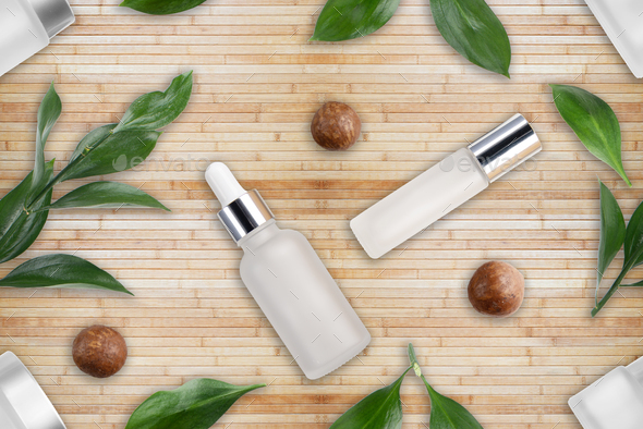 Tileable seamless flat lay background of bottles with macadamia nut cosmetics - Stock Photo - Images