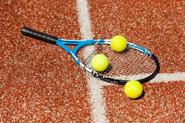 Time To Play Close Up Of Tennis Racket And Three Tennis Balls Laying On The Court Stock Photo By Gstockstudio