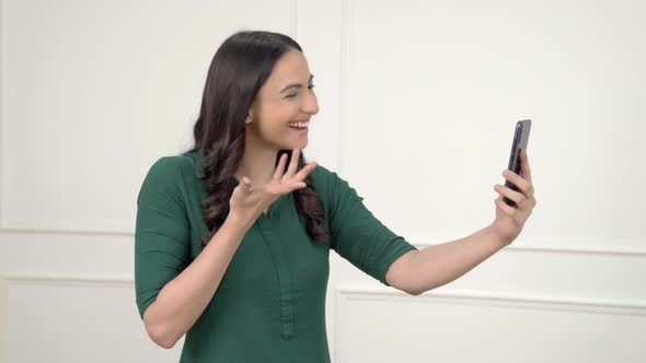 Indian girl taking on video call alt