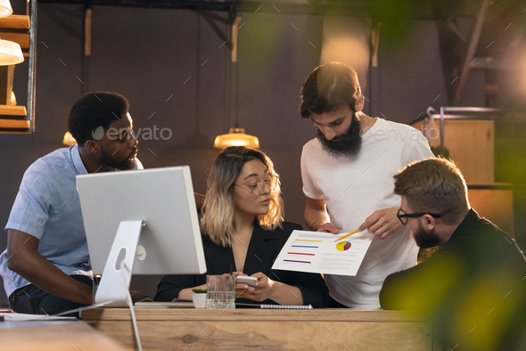 Colleagues working together in modern office using devices and gadgets during creative meeting - Stock Photo - Images