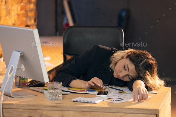 Businesswoman, manager working in modern office using devices and gadgets - Stock Photo - Images