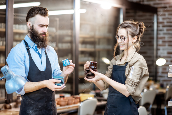 Man And Woman With Ceramics At The Pottery Stock Photo By Rosshelen