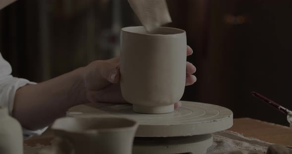 Professional Potter Working On A Cup