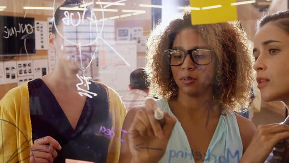 Business executives interacting in conference room alt