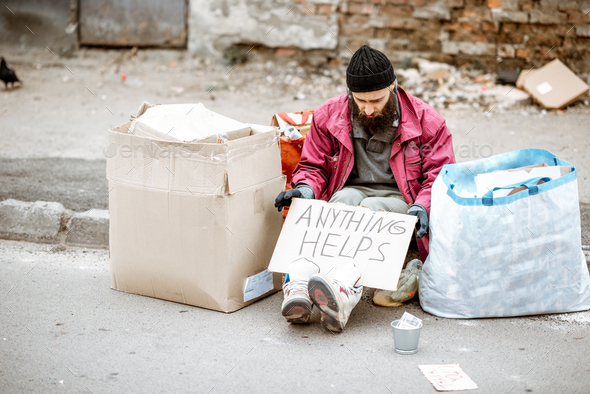 Homeless depressed beggar on the street Stock Photo by RossHelen ...