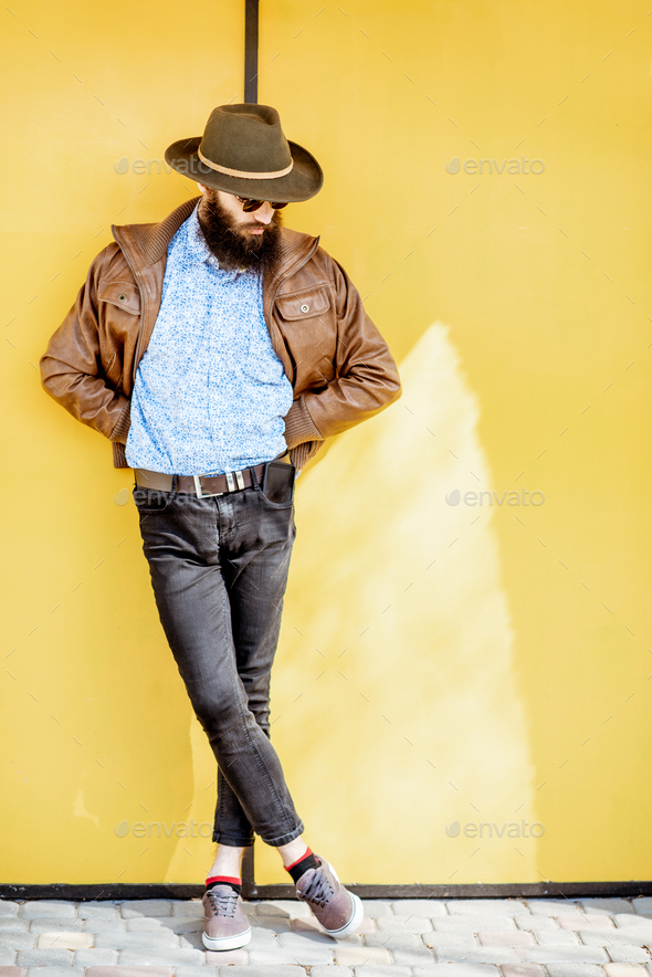 Portrait of a stylish man on the colorful background Stock Photo by ...