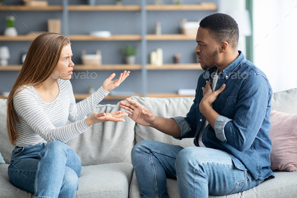 Interracial Couples Problems. Millennial Black Man And White Woman Arguing At Home