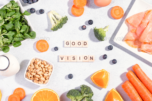 Assortment of foods for keeping eyes healthy with quote good vision