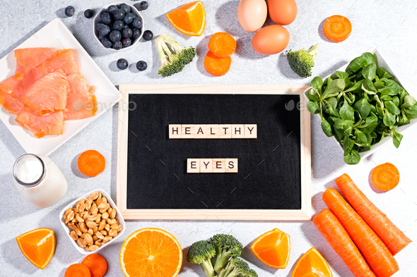 Assortment of foods for keeping eyes healthy and quote healthy eyes