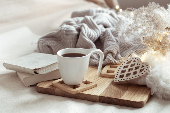 White cup with drink on blurred background home decor. Stock Photo by  puhimec