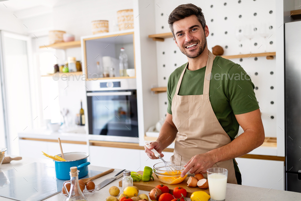 Funny Cooking. Attractive Caucasian Man In The Kitchen Stock Photo, Picture  and Royalty Free Image. Image 65857067.