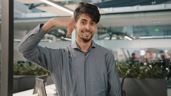 Young Man Smiling Arabian Office Manager Student Employer Looking at Camera Invite Hand Gesture alt