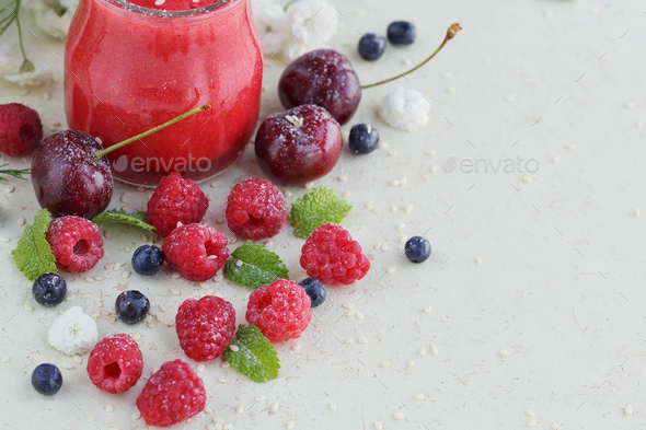 Delicious raspberry and sweet cherry smoothie or milk shake with fresh berries - Stock Photo - Images