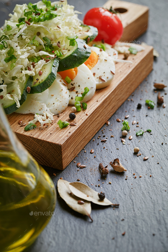 Healthy food ingredients with tomato, cucumber, cabbage, green onion, egg and spices - Stock Photo - Images
