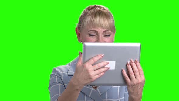 Portrait of Woman Talking Via Pc Tablet. alt