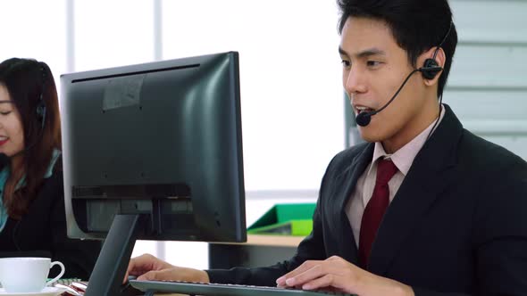 Business People Wearing Headset Working in Office alt