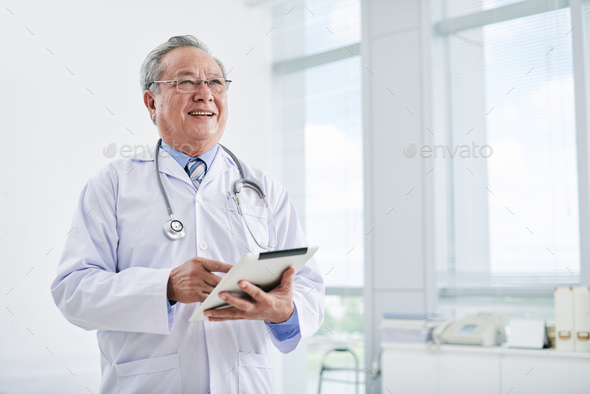 Aged general practitioner - Stock Photo - Images