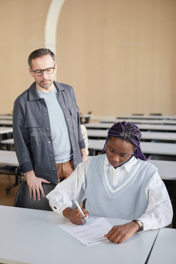 Professor Overseeing Exam Stock Photo By Seventyfourimages 