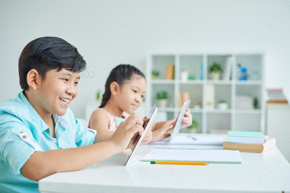 Schoolchildren with digital tablet