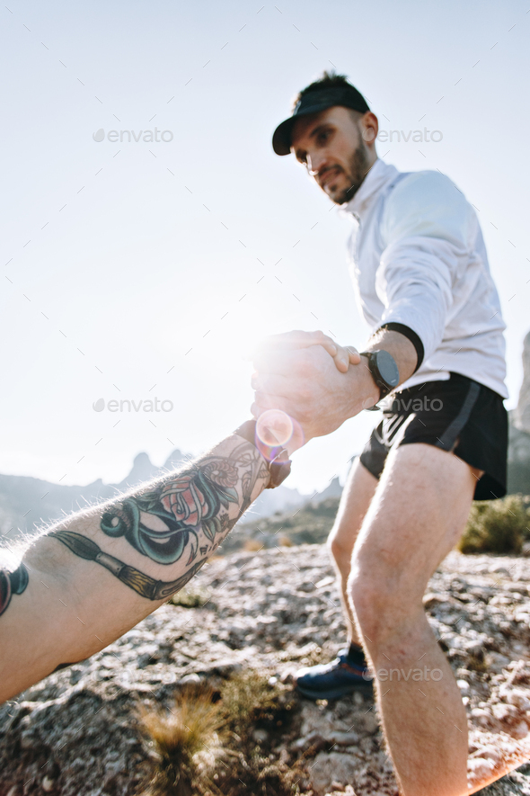 Cool man with tattoos ultra trail runner Stock Photo by bublikhaus