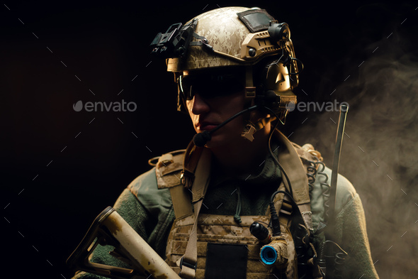 Special forces soldier with rifle on black background - Stock Photo - Images