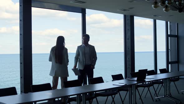 Stressed Business Partners Argue Contract Papers at Beautiful Panorama Window alt