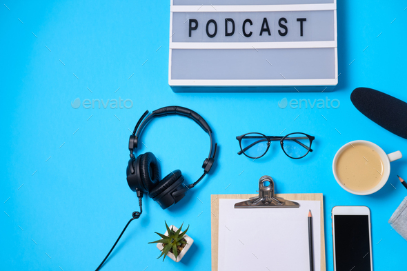 Music or podcast background with headphones, microphone, coffee and blank  Stock Photo by Boyarkinamarina