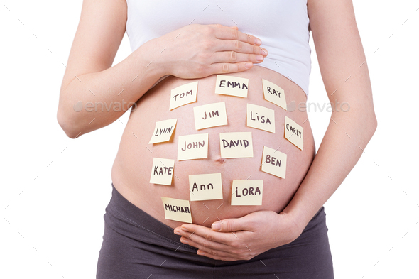 Baby names on her belly.  - Stock Photo - Images