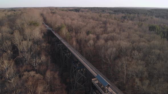 A dramatic orbital shot over High Bridge Trail, a reconstructed Civil War era railroad bridge in Vir alt