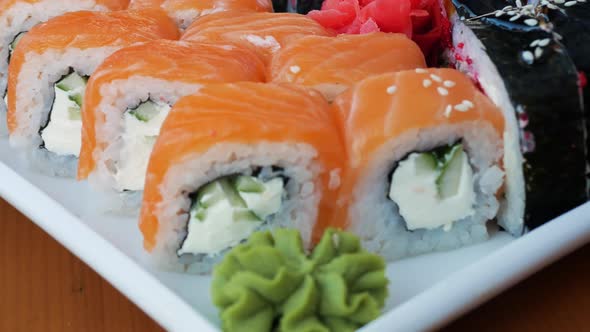 Appetizing Fresh Sushi Close Up, Wasabi Sushi In A White Plate