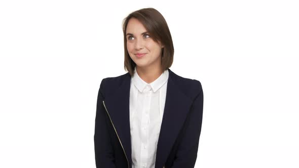 Portrait of Young Pretty Woman 30s Female Leader in Formal Wear Being Shy Rolling Eyes with Smile alt