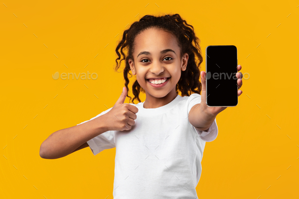 Black Girl Showing Blank Empty Smartphone Screen And Thumbs Up Stock 