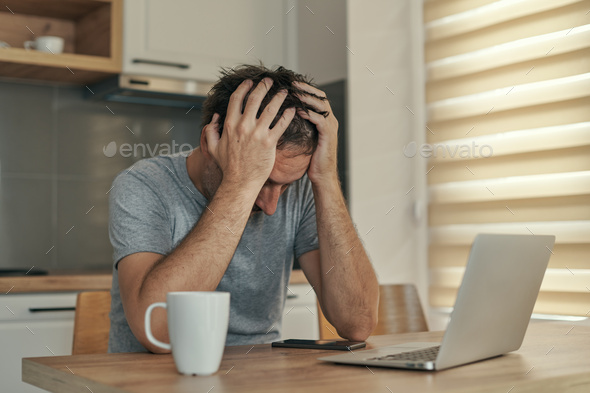 Disappointed freelancer at home office having job problems