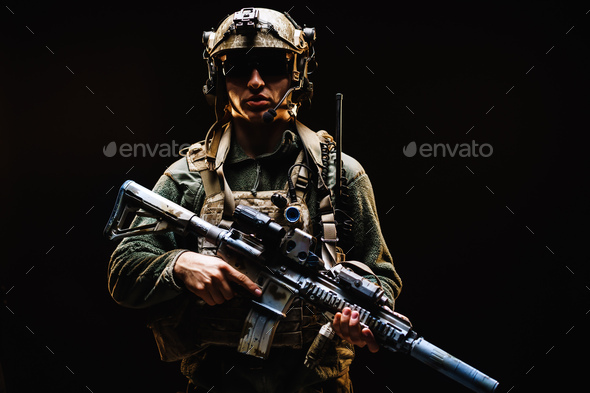 Special forces soldier with rifle on black background - Stock Photo - Images