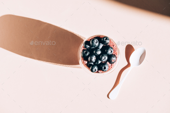 Healthy chia pudding in a glass with fresh blueberries - Stock Photo - Images