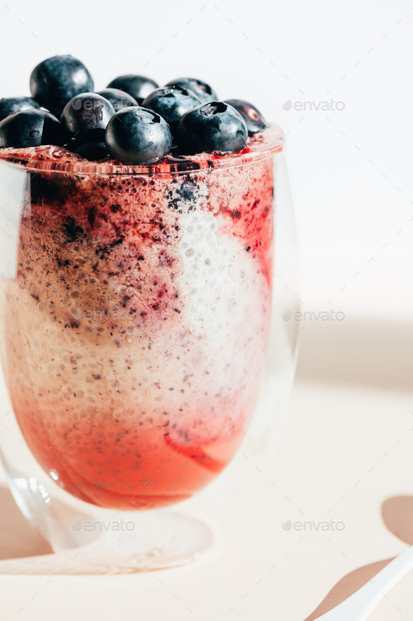 Healthy chia pudding in a glass with fresh blueberries - Stock Photo - Images