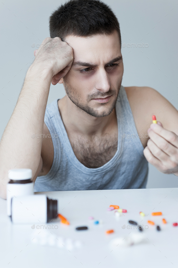 Numbing his pain. Stock Photo by gstockstudio PhotoDune