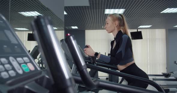 The Girl Goes In For Sports In The Gym. alt