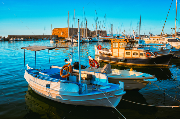 Venetian Fort in Heraklion and moored fishing boats, Crete Island, Greece - Stock Photo - Images