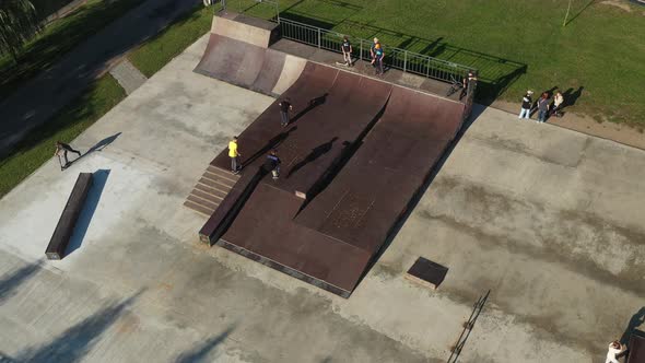 Children Ride on the Outdoor Skateboard Court