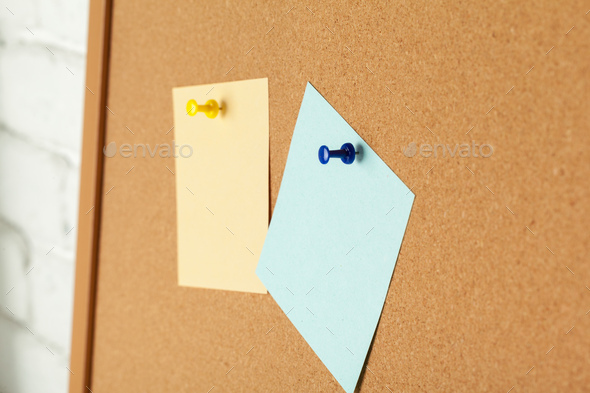 Cork board with several colorful blank notes with pins Stock Photo by  FabrikaPhoto